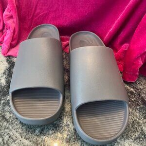 Nike Calm Slides. Minimalist sandals contoured, single-piece foam men11 women12